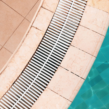 Brass & Aluminum Drain Grates: Finishes, Patinas, and the Art of Aging